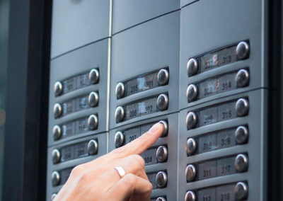 Cropped hand pressing button building